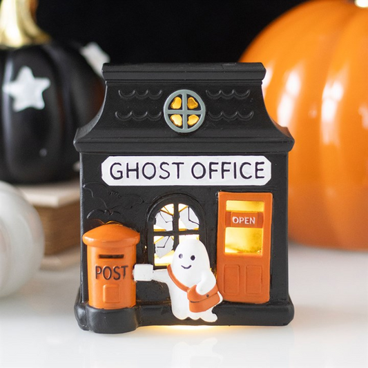 Halloween-themed decorative light with 'Ghost Office' and ghost character, surrounded by pumpkins.